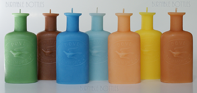 A group of DOVE (embossed dove) RICHMOND, VA. bottle candles --- Burnable Bottles - AntiqueBottleHunter.com