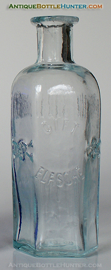 A light aqua GIFT / FLASCHE skull and crossbone poison. --- Antiquebottlehunter.com